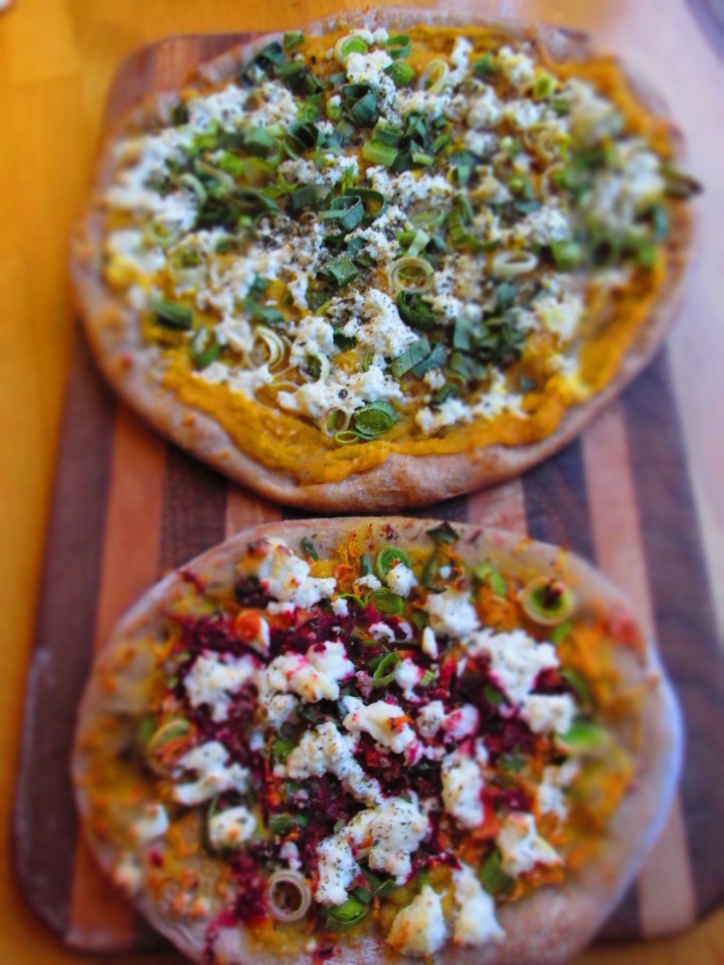 healthy pizzas with squash, beets, carrots snuck into the sauce layer